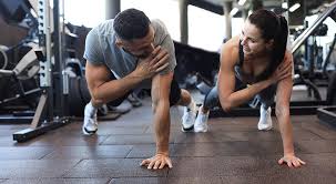 Sculpting Sleek Arms: The Essential Role of Cardio in Toning Without Bulking Up 1 Image of man and woman doing Cardio St Albans to tone their arms.